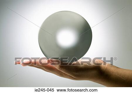 A person holding a crystal ball View Large Photo Image Stock Photography - A person holding a crystal ball. Fotosearch