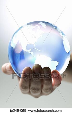 A person holding planet earth View Large Photo Image Stock Photo - A person holding planet earth. Fotosearch