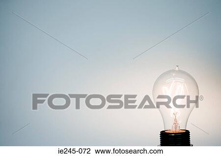 An illuminated lightbulb View Large Photo Image Stock Image - An illuminated lightbulb. Fotosearch