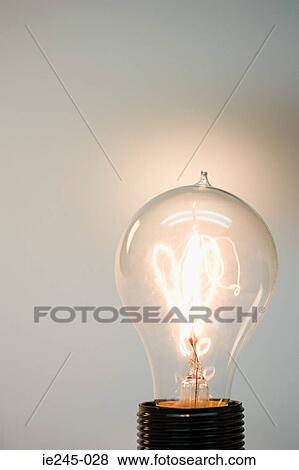 An illuminated lightbulb View Large Photo Image Stock Photo - An illuminated lightbulb. Fotosearch