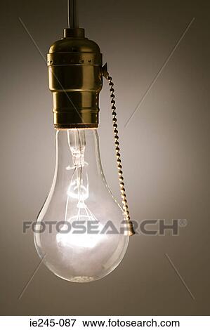 An illuminated lightbulb View Large Photo Image Stock Photo - An illuminated lightbulb. Fotosearch