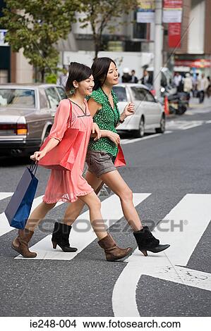 Friends shopping in tokyo View Large Photo Image Picture - Friends shopping in tokyo. Fotosearch