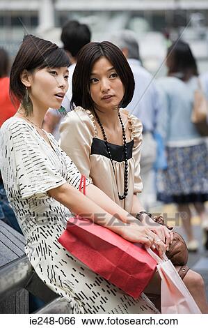 Two friends talking View Large Photo Image Stock Photograph - Two friends talking. Fotosearch