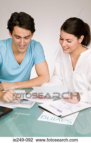Couple arranging finances View Large Photo Image Stock Image - Couple arranging finances. Fotosearch
