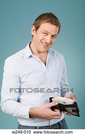 Man with a full wallet View Large Photo Image Stock Image - Man with a full wallet. Fotosearch