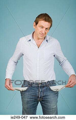 Man with empty pockets View Large Photo Image Stock Photo - Man with empty pockets. Fotosearch