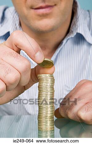 Man with stack of pounds View Large Photo Image Picture - Man with stack of pounds. Fotosearch