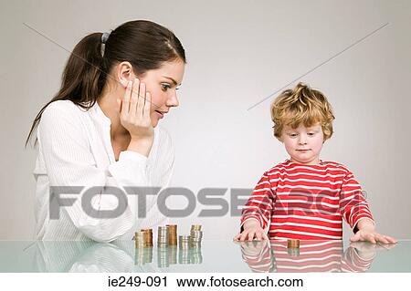 Stock Image - Woman and boy with coins. Fotosearch