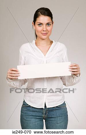 Woman holding blank sign View Large Photo Image Stock Image - Woman holding blank sign. Fotosearch
