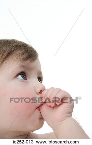 Baby girl sucking her thumb View Large Photo Image Stock Image - Baby girl sucking her thumb. Fotosearch