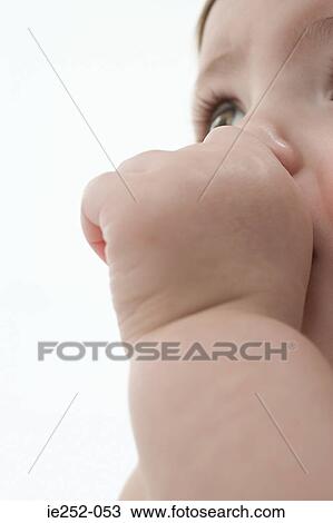 Stock Image - Baby sucking thumb. Fotosearch