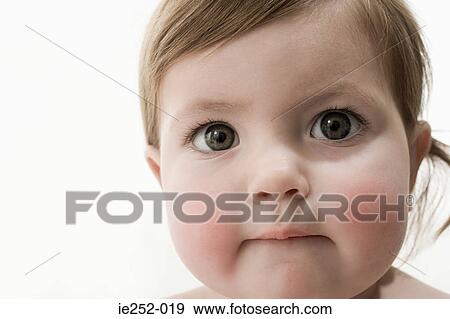 Face of a baby girl View Large Photo Image Stock Photo - Face of a baby girl. Fotosearch