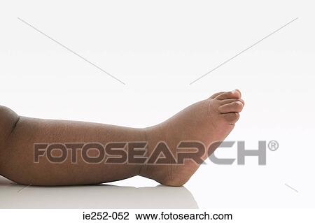 Stock Image - Leg and foot of a baby. Fotosearch