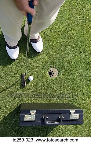 A person playing golf View Large Photo Image Stock Image - A person playing golf. Fotosearch