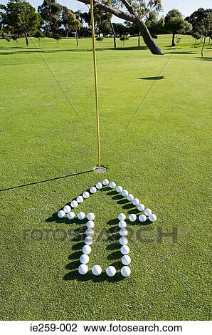 An arrow pointing to a hole on a golf green View Large Photo Image Stock Image - An arrow pointing to a hole on a golf green. Fotosearch