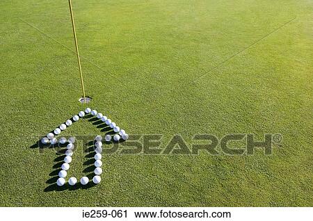 An arrow pointing to a hole on a golf green View Large Photo Image Stock Image - An arrow pointing to a hole on a golf green. Fotosearch