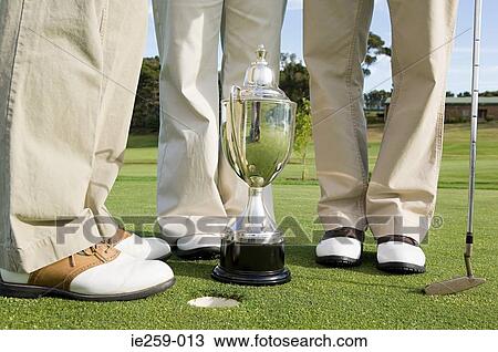 Golfers legs and a trophy View Large Photo Image Stock Image - Golfers legs and a trophy. Fotosearch