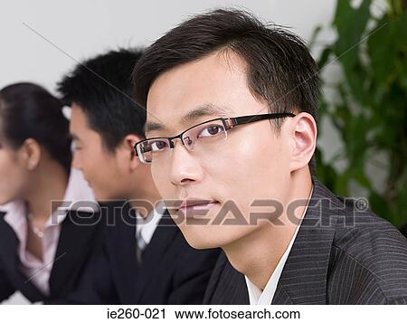 Stock Image - Businessman in meeting. Fotosearch