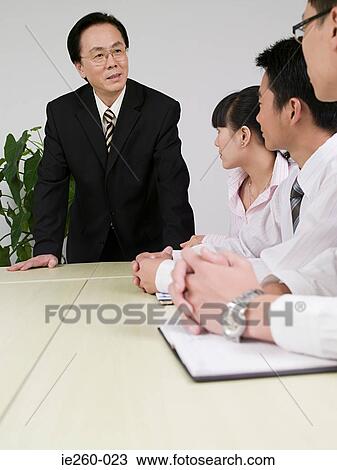 Stock Image - Businessman in meeting. Fotosearch