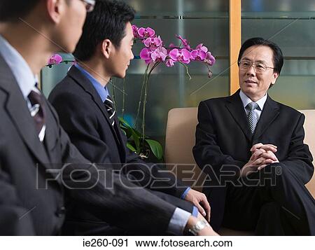 Businessmen in conversation View Large Photo Image Stock Image - Businessmen in conversation. Fotosearch