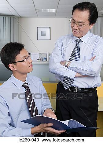 Businessmen in office View Large Photo Image Stock Image - Businessmen in office. Fotosearch