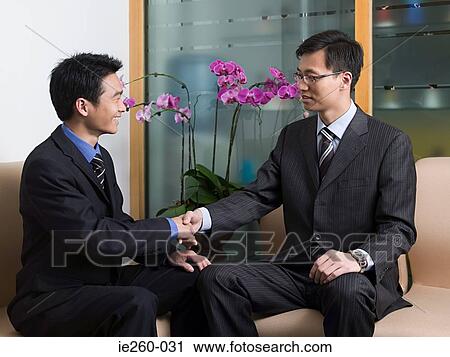 Businessmen shaking hands View Large Photo Image Stock Image - Businessmen shaking hands. Fotosearch