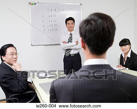 Businesspeople in meeting View Large Photo Image Picture - Businesspeople in meeting. Fotosearch