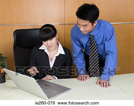 Businesspeople in office View Large Photo Image Stock Photo - Businesspeople in office. Fotosearch
