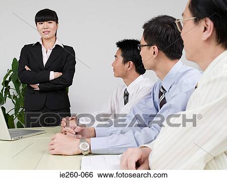 Stock Photograph - Businesswoman in meeting. Fotosearch
