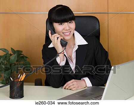 Businesswoman on telephone View Large Photo Image Picture - Businesswoman on telephone. Fotosearch