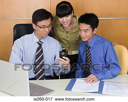 Stock Photo - Colleagues in office. Fotosearch