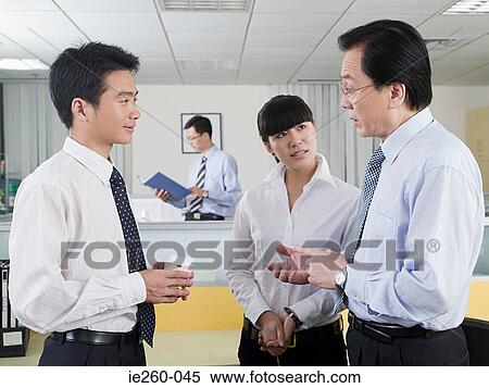 Colleagues in office View Large Photo Image Stock Photography - Colleagues in office. Fotosearch