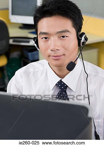 Man wearing a headset View Large Photo Image Stock Photography - Man wearing a headset. Fotosearch