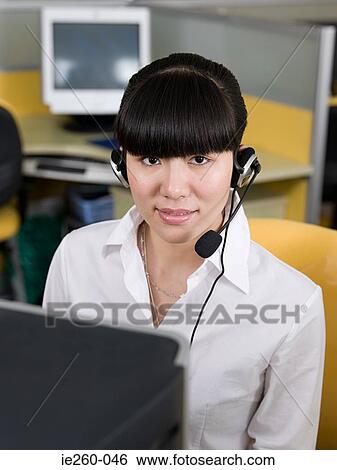 Office worker with headset View Large Photo Image Stock Photograph - Office worker with headset. Fotosearch