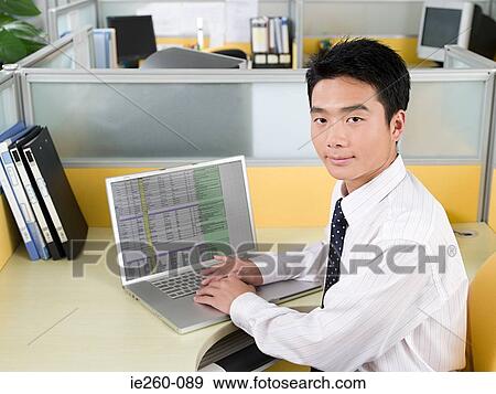 Office worker with laptop View Large Photo Image Stock Photo - Office worker with laptop. Fotosearch