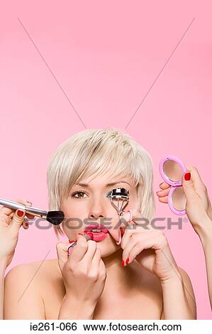 Woman being made up View Large Photo Image Stock Photograph - Woman being made up. Fotosearch
