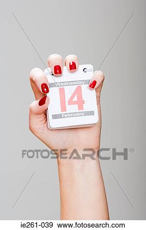 Woman holding calendar on valentines day View Large Photo Image Stock Photo - Woman holding calendar on valentines day. Fotosearch