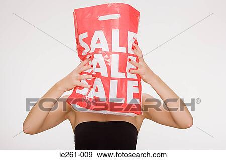 Woman with sale bag View Large Photo Image Stock Photo - Woman with sale bag. Fotosearch