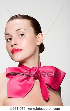 Young woman wearing a bow View Large Photo Image Stock Image - Young woman wearing a bow. Fotosearch