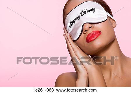 Young woman wearing sleeping mask View Large Photo Image Stock Image - Young woman wearing sleeping mask. Fotosearch