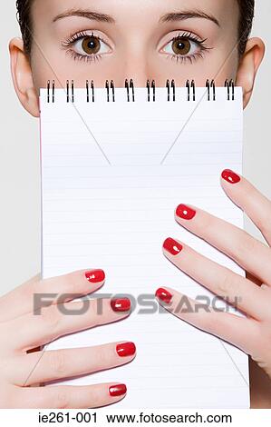 Young woman with notepad View Large Photo Image Stock Image - Young woman with notepad. Fotosearch