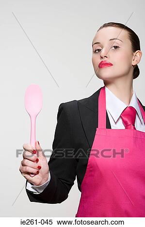 Young woman with spoon View Large Photo Image Stock Photography - Young woman with spoon. Fotosearch