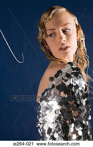 Stock Image - Young woman and fishing hook. Fotosearch