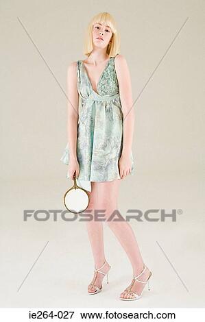 Stock Photo - Young woman with mirror. Fotosearch