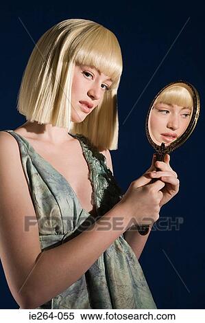 Young woman with mirror View Large Photo Image Stock Photography - Young woman with mirror. Fotosearch
