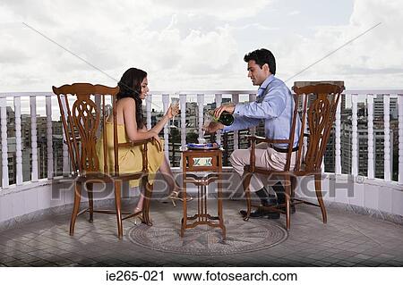 A couple having champagne View Large Photo Image Stock Image - A couple having champagne. Fotosearch