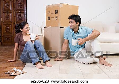 A couple moving house View Large Photo Image Stock Image - A couple moving house. Fotosearch