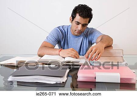 Stock Image - A man studying. Fotosearch