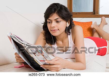 A woman reading a magazine View Large Photo Image Stock Image - A woman reading a magazine. Fotosearch