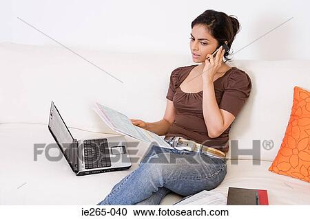 A woman sorting out her finances View Large Photo Image Stock Image - A woman sorting out her finances. Fotosearch